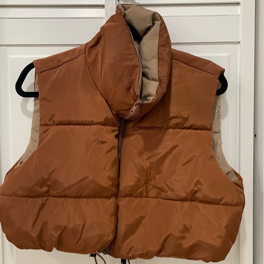 It’s a cropped vest jacket .